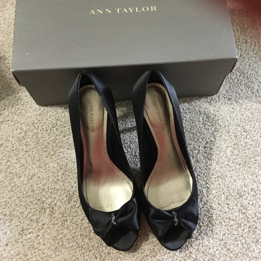Black satin pumps